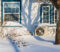 Heat Pump Heat pump unit on the side of a home in winter.